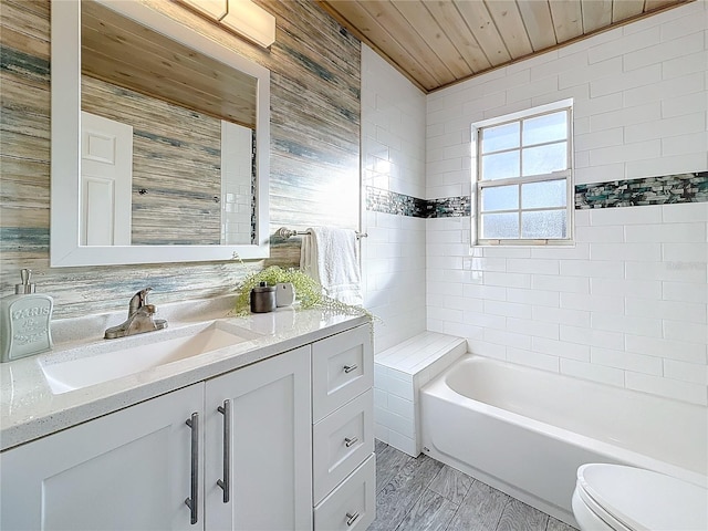 bathroom with vanity, a bath, wooden ceiling, and toilet