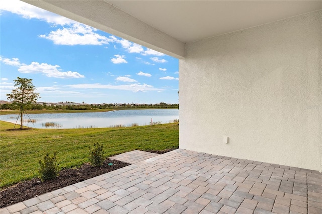 view of patio / terrace with a water view