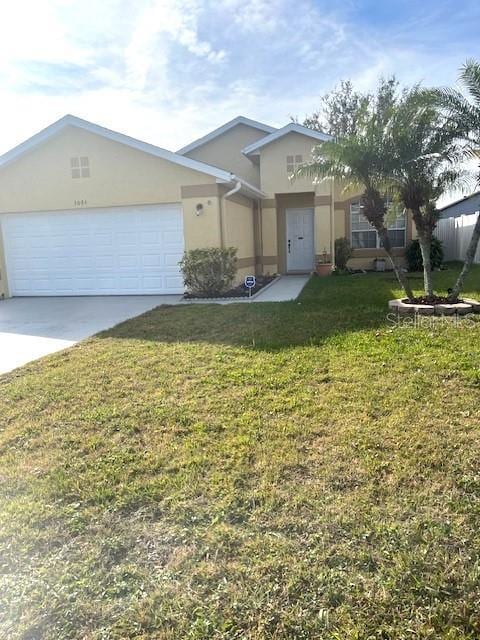 view of front of house featuring a garage and a front lawn