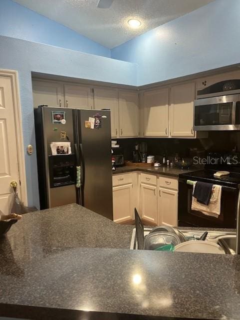 kitchen featuring white cabinetry, appliances with stainless steel finishes, a textured ceiling, and backsplash