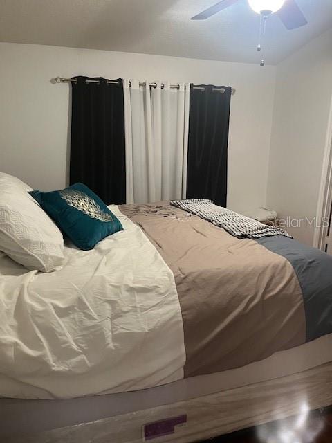 bedroom featuring ceiling fan