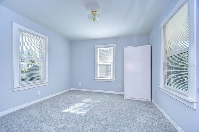 unfurnished bedroom featuring a closet and carpet