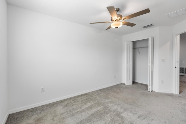 unfurnished bedroom with ceiling fan, a closet, and light carpet