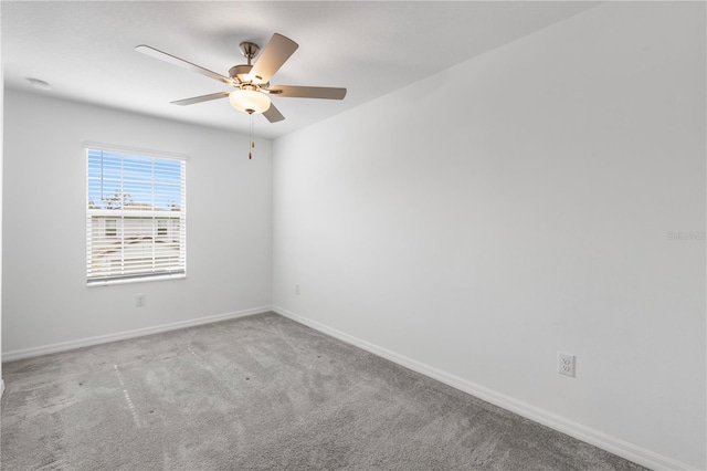 empty room with carpet and ceiling fan