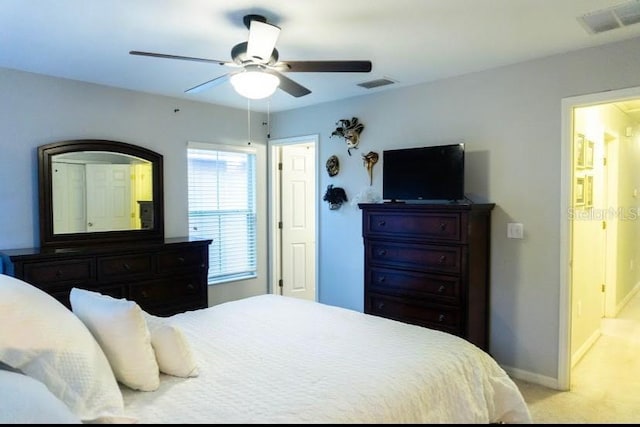 bedroom with light colored carpet and ceiling fan