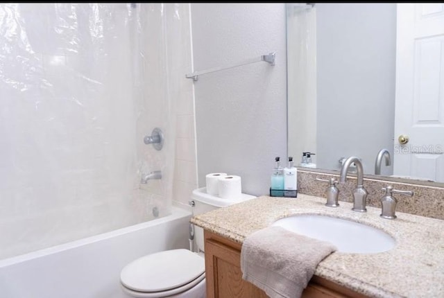 full bathroom with shower / bathtub combination with curtain, vanity, and toilet