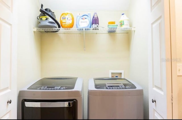 laundry area with washer and clothes dryer