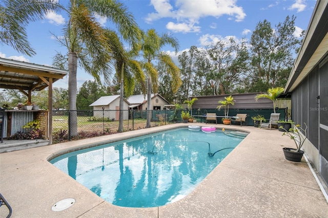 view of swimming pool featuring a patio area