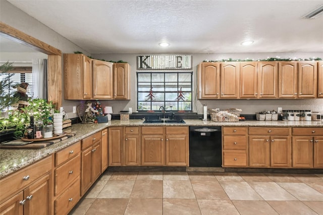 kitchen featuring dishwasher, light stone countertops, sink, and a textured ceiling