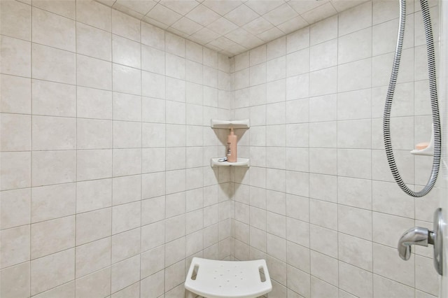 bathroom with a tile shower