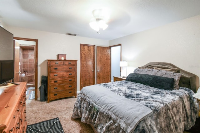 carpeted bedroom featuring a closet and ceiling fan