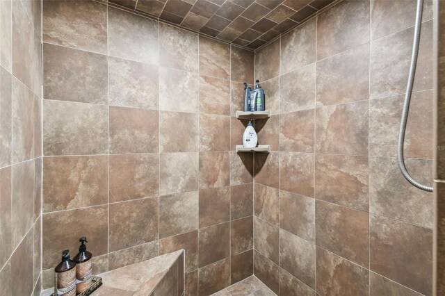 bathroom with tiled shower