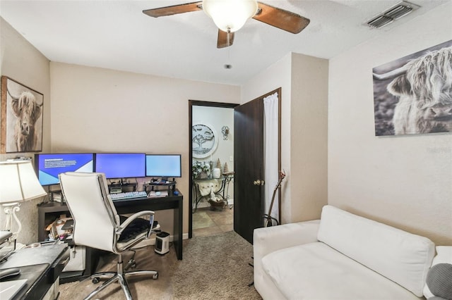 office area with light carpet and ceiling fan