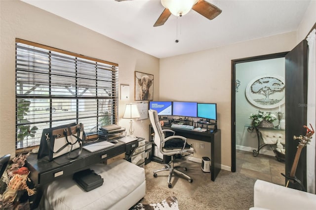 office area with carpet floors and ceiling fan