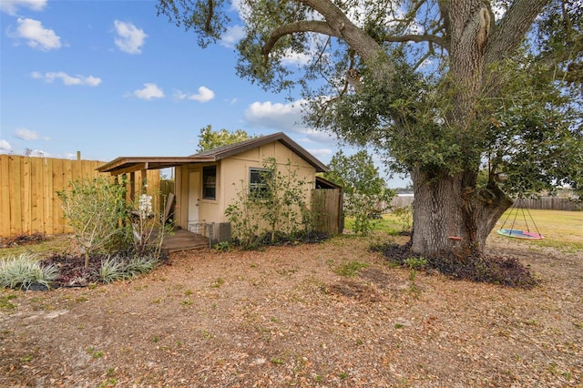 view of home's exterior featuring an outbuilding