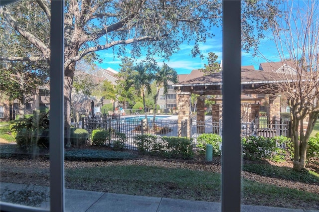 exterior space featuring a gazebo and a community pool