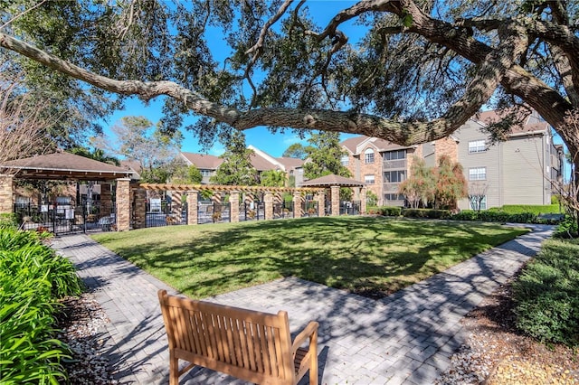 view of home's community with a gazebo and a lawn