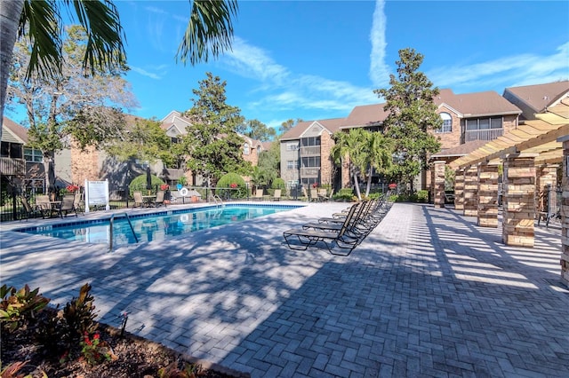 view of swimming pool with a pergola and a patio area