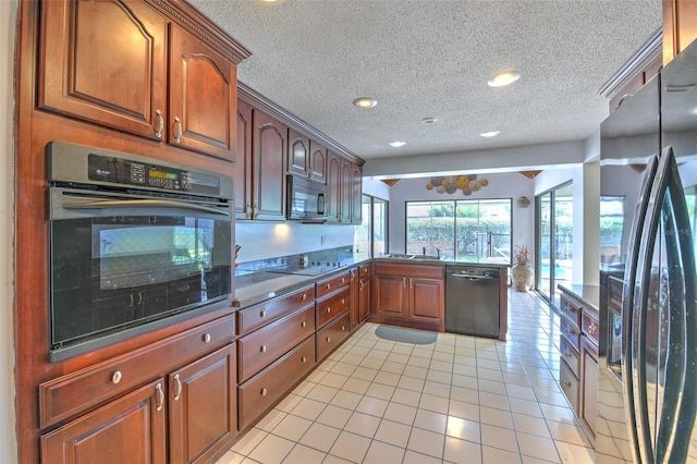 kitchen with sink, black appliances, a textured ceiling, and light tile patterned flooring