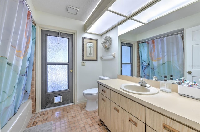 full bathroom featuring vanity, shower / bathtub combination with curtain, and toilet