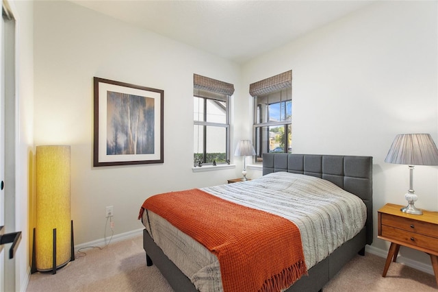 bedroom with light colored carpet