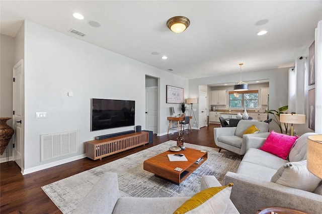 living room featuring dark hardwood / wood-style floors