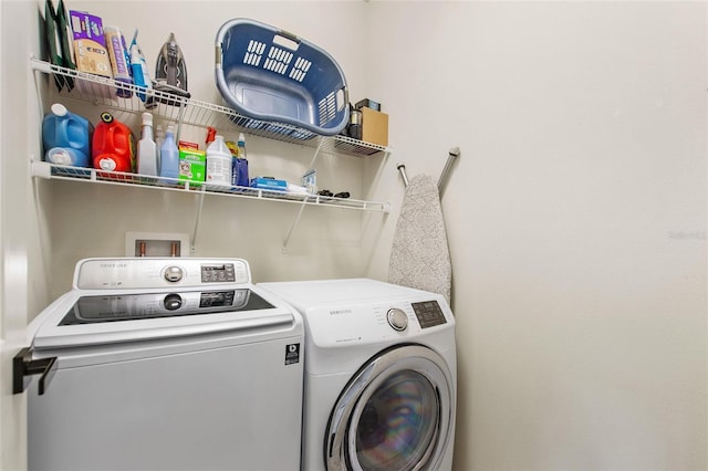 washroom with separate washer and dryer