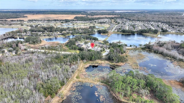 drone / aerial view with a water view