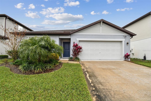 ranch-style home with a garage and a front yard