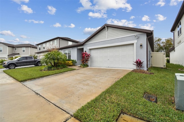 view of front of home featuring a garage, central AC, and a front yard