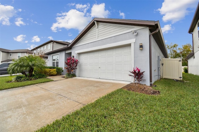 ranch-style home with a garage and a front lawn