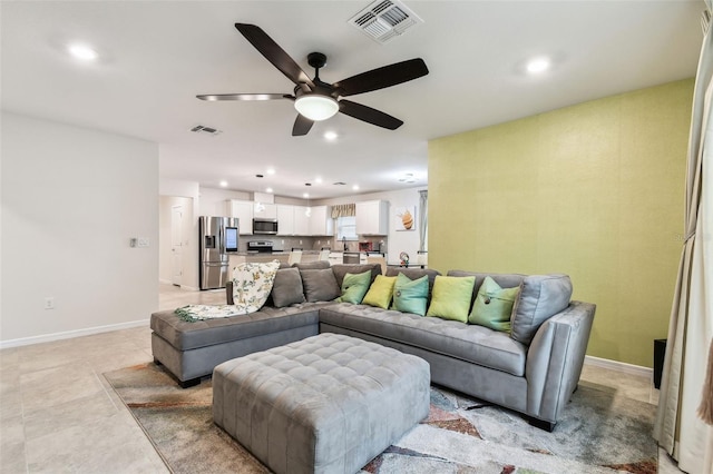 living room with ceiling fan