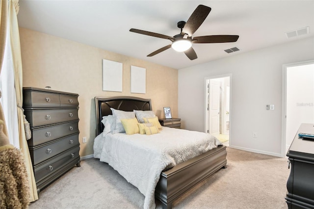 carpeted bedroom with ceiling fan and ensuite bathroom