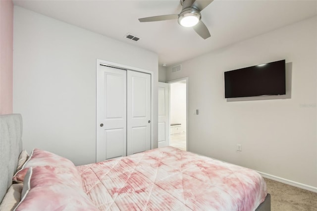 carpeted bedroom with a closet and ceiling fan