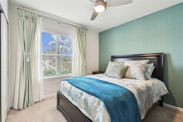 carpeted bedroom featuring ceiling fan