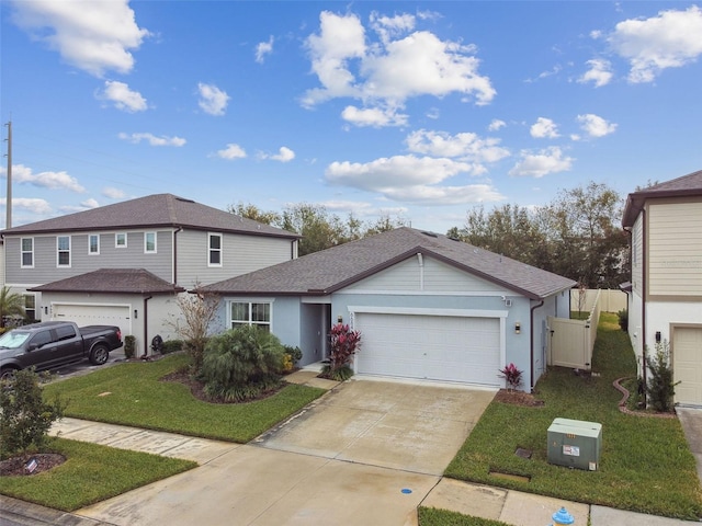 front facade with a garage and a front lawn