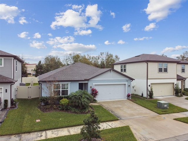 front of property with a garage and a front lawn