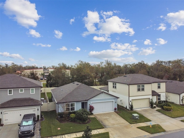 front of property with a garage and a front yard