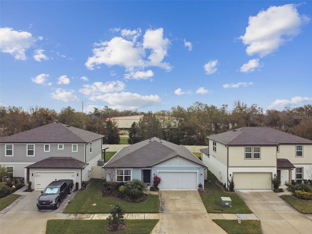 view of front of house with a garage and a front yard