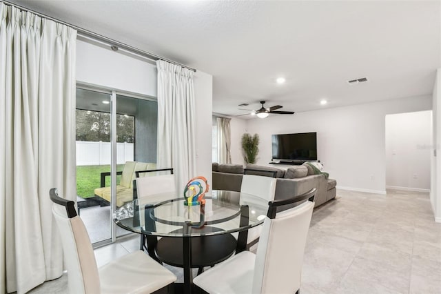 6684 Devlin Ln, Wesley Chapel, FL 33545 - dining area featuring a wealth of natural light, a ceiling fan, visible vents, and baseboards