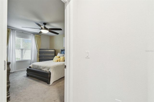 6684 Devlin Ln, Wesley Chapel, FL 33545 - carpeted bedroom featuring a ceiling fan and baseboards