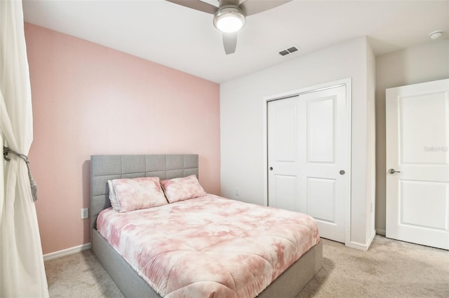 6684 Devlin Ln, Wesley Chapel, FL 33545 - bedroom featuring a closet, baseboards, visible vents, and light colored carpet
