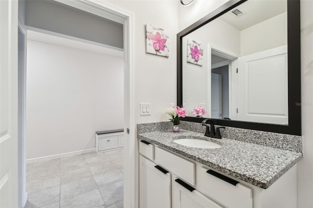 6684 Devlin Ln, Wesley Chapel, FL 33545 - bathroom with visible vents, tile patterned floors, and vanity