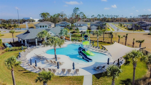 6684 Devlin Ln, Wesley Chapel, FL 33545 - exterior space with a pool, fence, a patio area, and a residential view