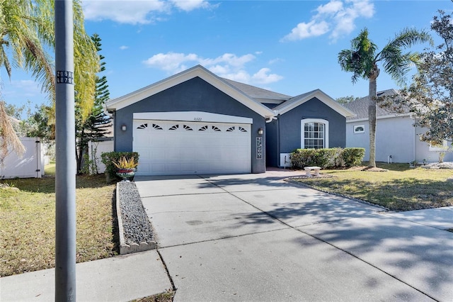 single story home with a garage and a front yard