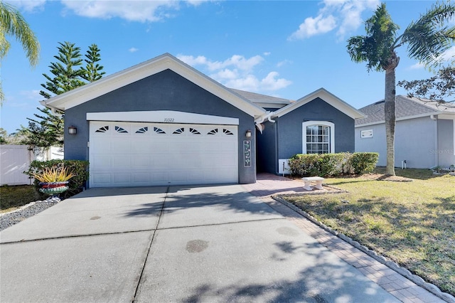 ranch-style house with a garage and a front lawn