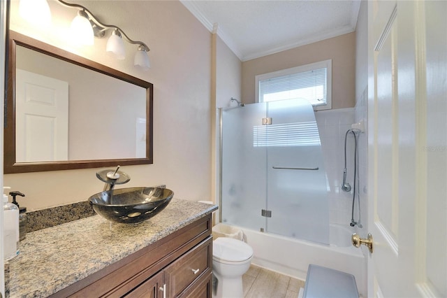 full bathroom with vanity, ornamental molding, shower / washtub combination, and toilet