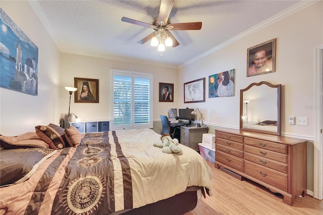 bedroom featuring crown molding, ceiling fan, light hardwood / wood-style floors, and a textured ceiling