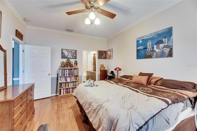 bedroom with crown molding, light hardwood / wood-style floors, and ceiling fan