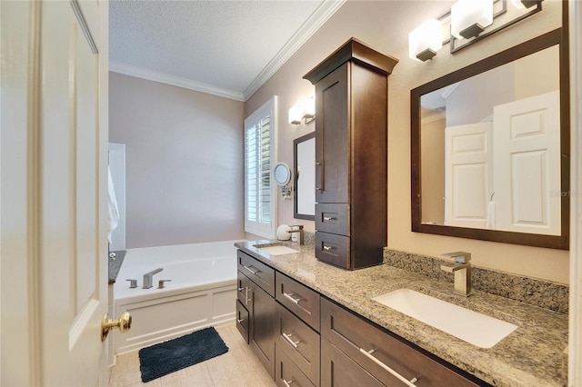 bathroom with vanity, a bath, ornamental molding, a textured ceiling, and tile patterned floors